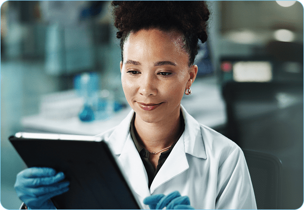 female-scientist-analyzes-data-on-tablet-in-lab